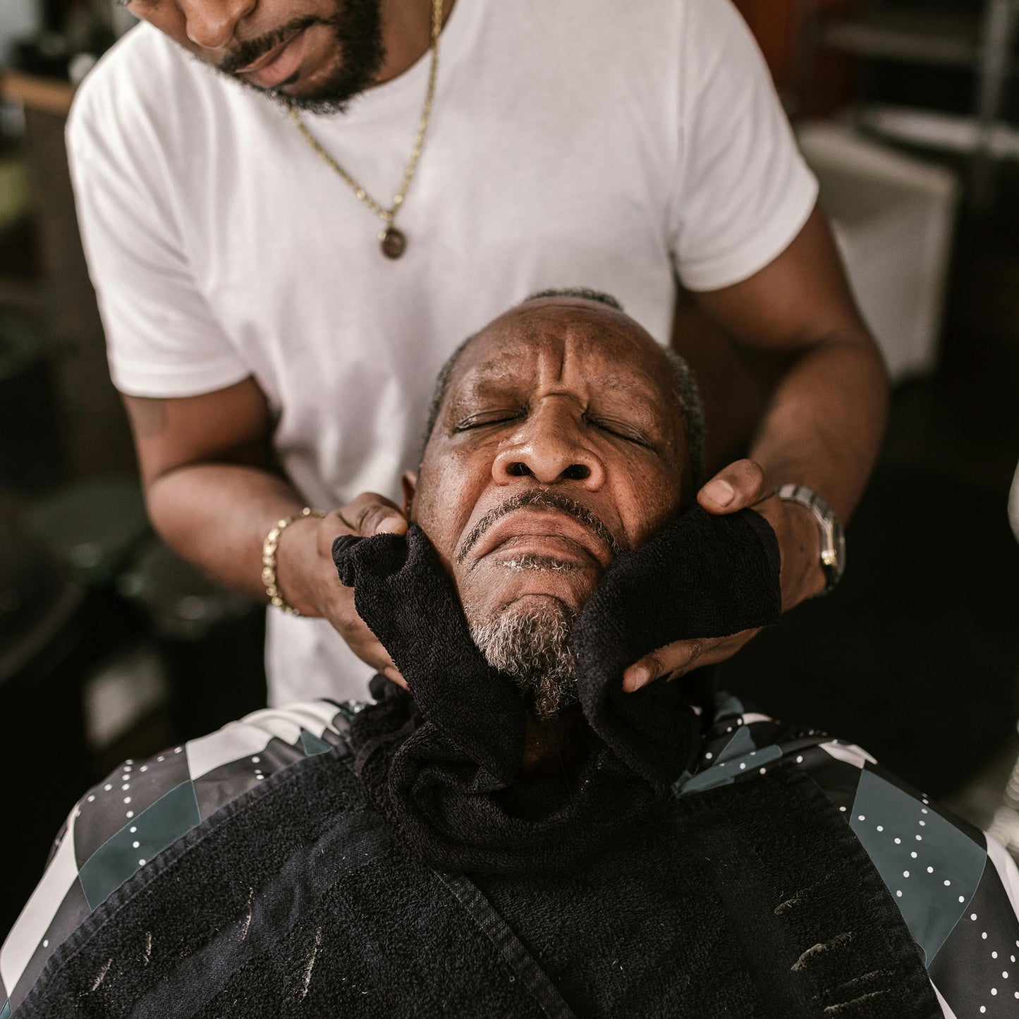 Barber with a client at a barbershop