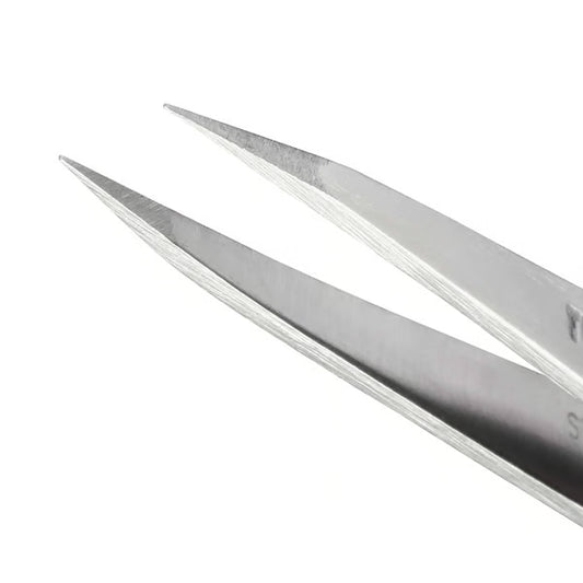 Pair of metal tweezers on a white background